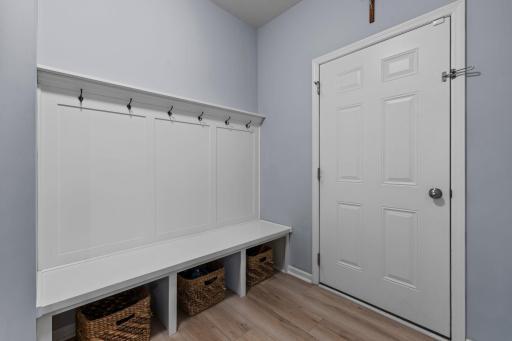 Mudroom with built-in bench and cubbies