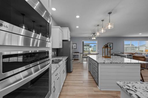 Gourmet Kitchen with informal dining space off of the living room / kitchen area. Sliding door onto the deck