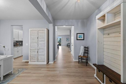 Large foyer with new flooring and fixture