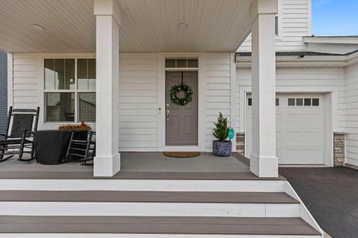 Updated composite maintenance free front porch with extended stairs corner to corner. Removed builder-grade wood porch and steps.