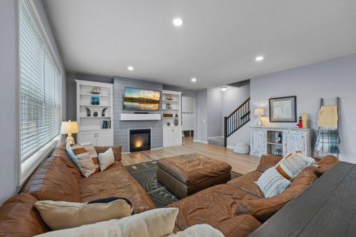 Living Room with Custom Built-in Cabinets, recessed lighting, tinted windows, new floors