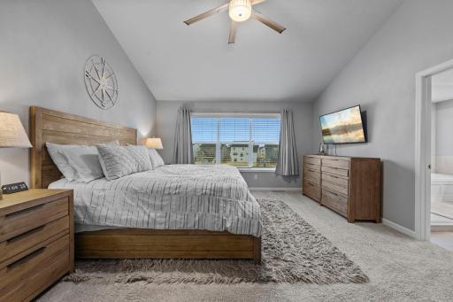 Owner's Suite with Vaulted Ceiling, Knockdown Ceiling throughout, Ceiling Fan, and Tinted Windows