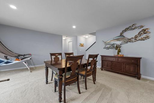 Lower level family room with angle towards the stairway halfwall