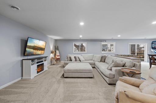 Behind the family room enjoy a lower-level bedroom, storage space, and sliding door to the walkout backyard!