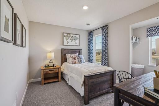 Three secondary bedrooms ideal for guests, office, or hobbies. Model photos. Options and colors may vary.