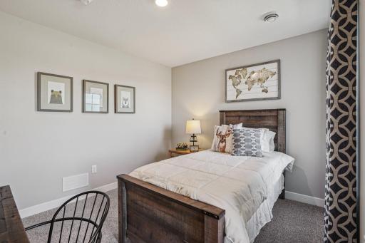 Three secondary bedrooms ideal for guests, office, or hobbies. Model photos. Options and colors may vary.