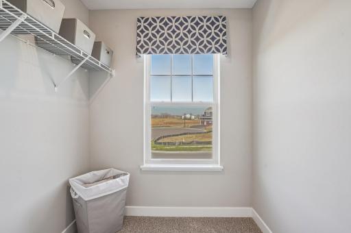 Three secondary bedrooms ideal for guests, office, or hobbies. Model photos. Options and colors may vary.