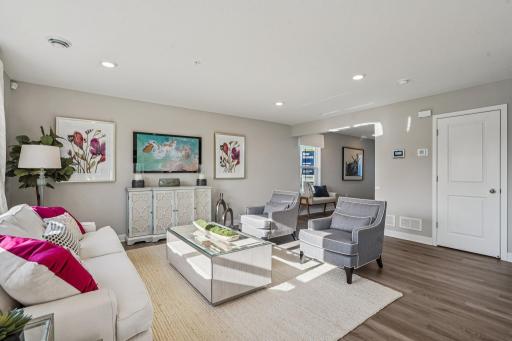 Light-filled living area with room to entertain and live. Photo is of model home. Colors and options may vary.