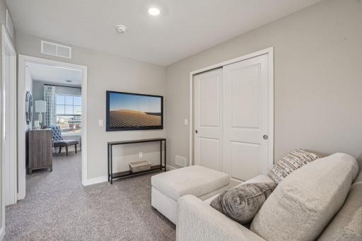 Loft on the second floor of the home, perfect for remote working! Photo is of model home. Colors and options may vary.