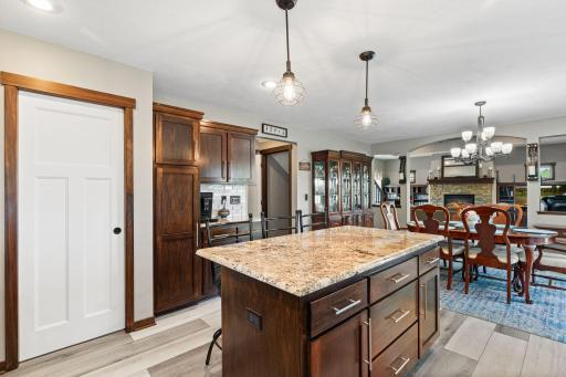 Large center island, abundance of cabinetry accepted by Craftsmans style, white doors. Great pantry for all the kitchen extras.