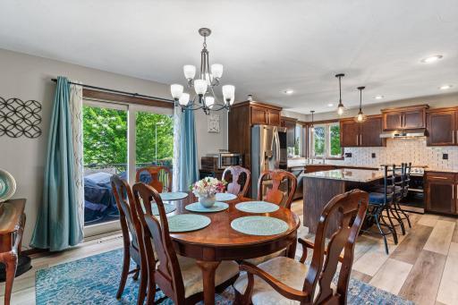 Spacious informal dining walks out to private deck.