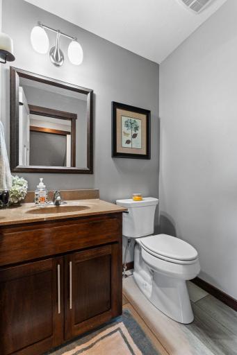Convenient 1/2 bathroom on the main level. Upgraded Corian countertops in all bathrooms.