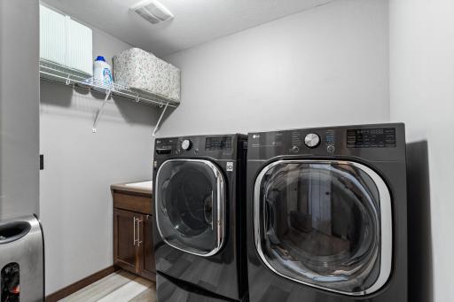 Main level laundry with upgraded washer / dryer.