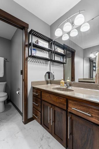 Full bathroom on the upper level. Upgraded Corian countertops.