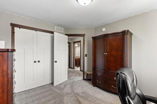Neutral carpeting, paint and beautiful Craftsmans Style, white panel doors.