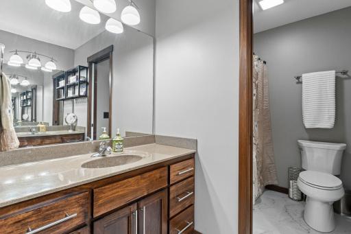 Full bathroom on the upper level. Upgraded Corian countertops.