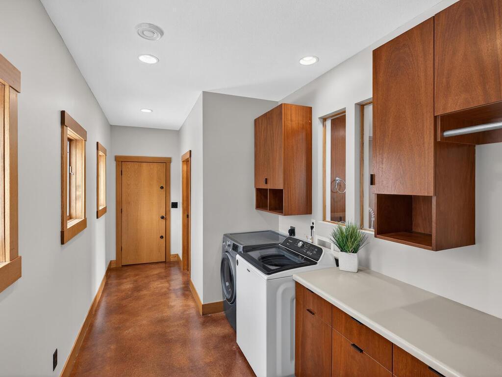 Large laundry space with windows and cabinets for storage and bright light 34290 Lanesboro Ct North Branch MN 55056 USA-056-037-054-MLS_Size.jpg