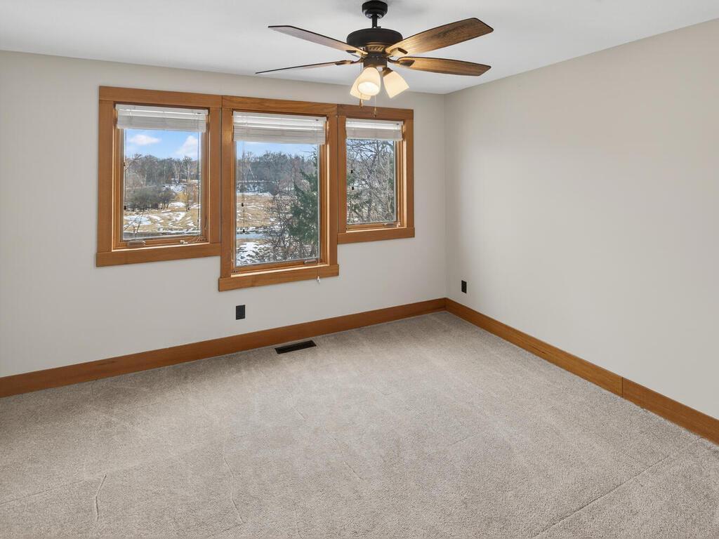 Bedroom 4 with large river view widows and ceiling fan - 34290 Lanesboro Ct North Branch MN 55056 USA-065-067-063-MLS_Size.jpg