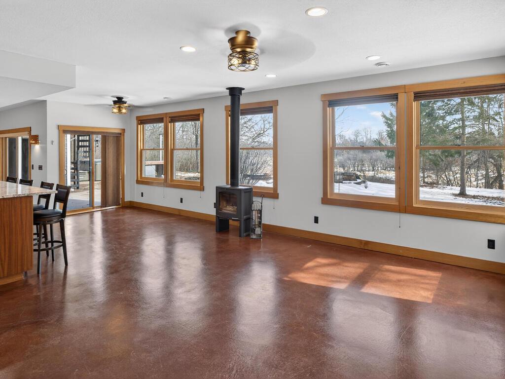 Bright Main Living Area: Expansive windows bring in natural light and wooded views 34290 Lanesboro Ct North Branch MN 55056 USA-026-024-026-MLS_Size.jpg