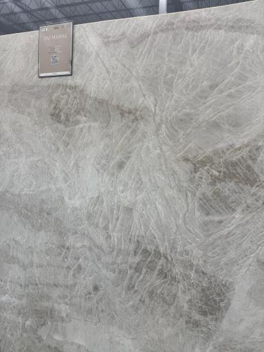 Natural stone countertops throughout the entire home. The kitchen, prep pantry and primary bathroom all feature stunning Taj Mahal Quartzite.