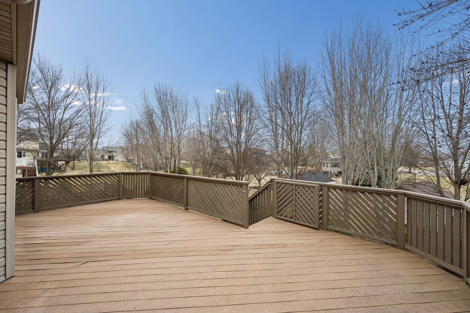 Large deck off dining room overlooking private back yard