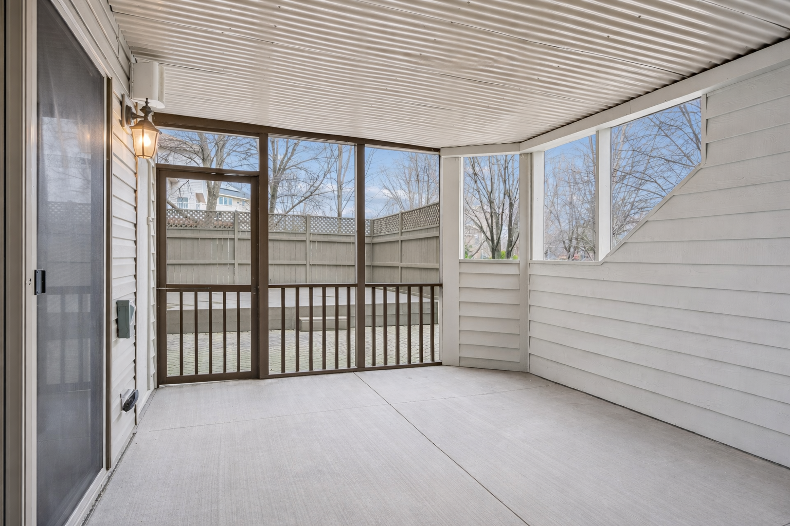 Screened in porch walks out to patio area