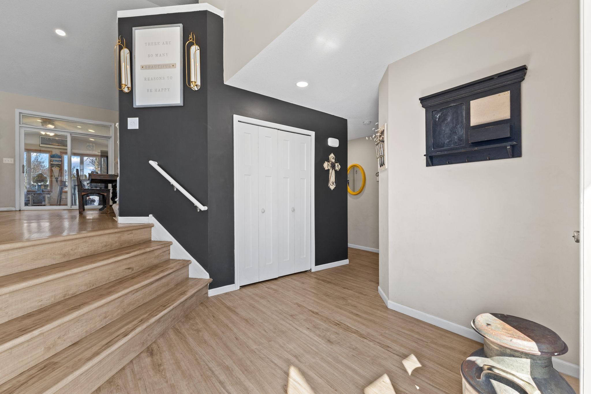 The impressive style of this home begins with gleaming hard surface floors that flow throughout the main level, neutral tones, and vaulted ceilings.