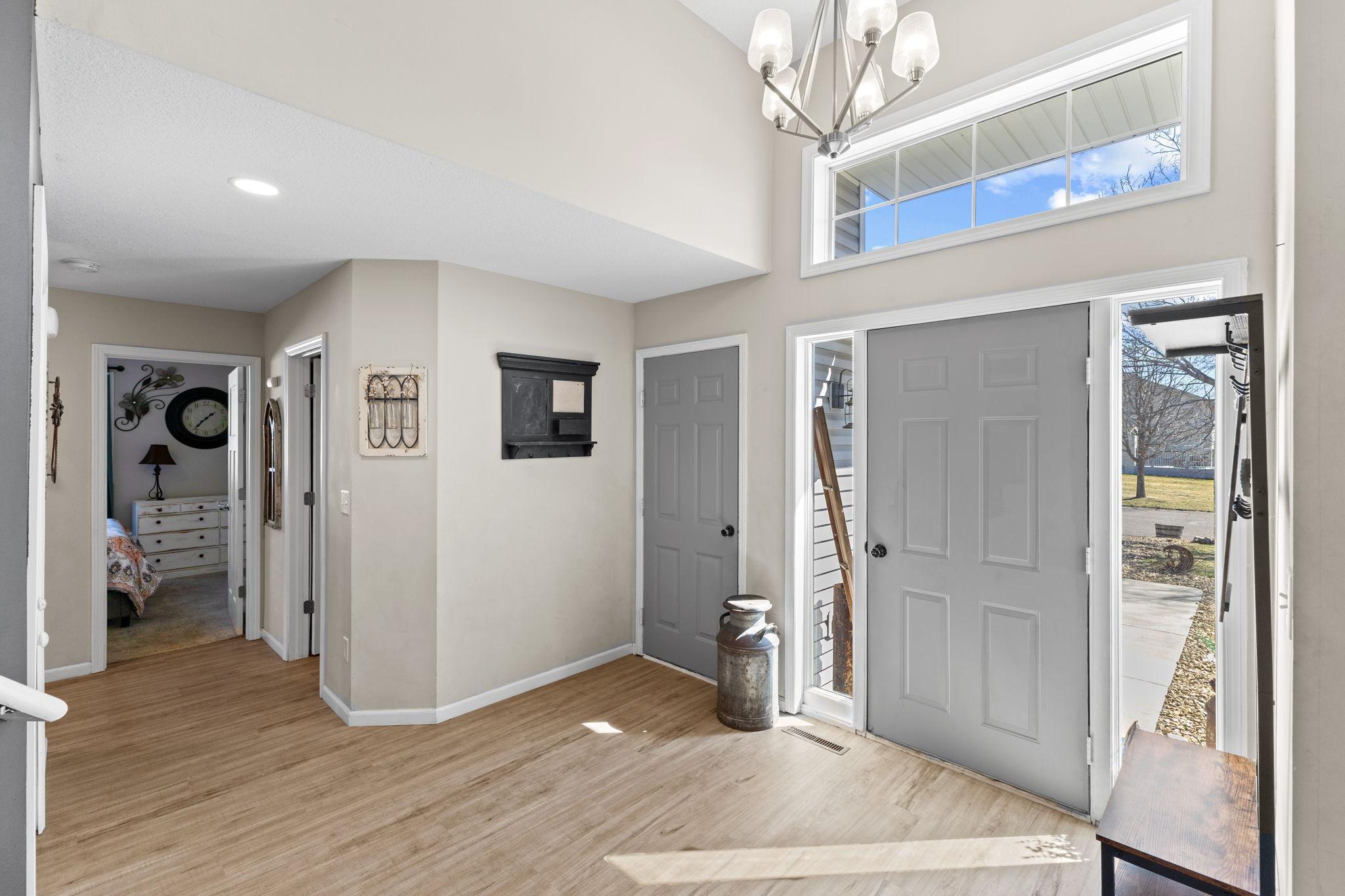 Easily welcome guests without feeling crowded in the spacious foyer, featuring a convenient closet to keep coats and shoes neatly tucked away.