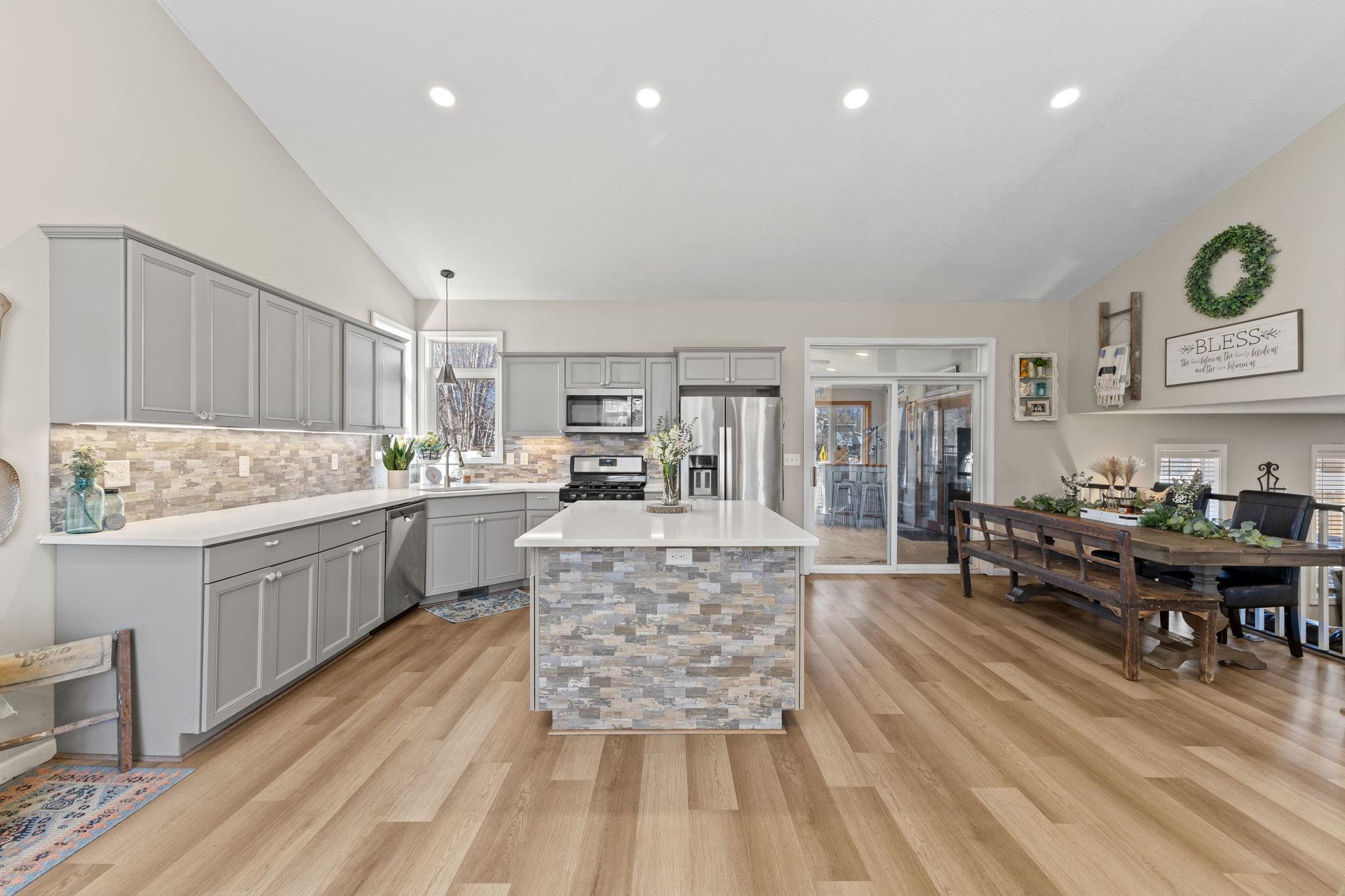 Easily access the sunroom through glass sliding doors that lead directly to the deck and backyard, seamlessly extending your living and entertaining space.