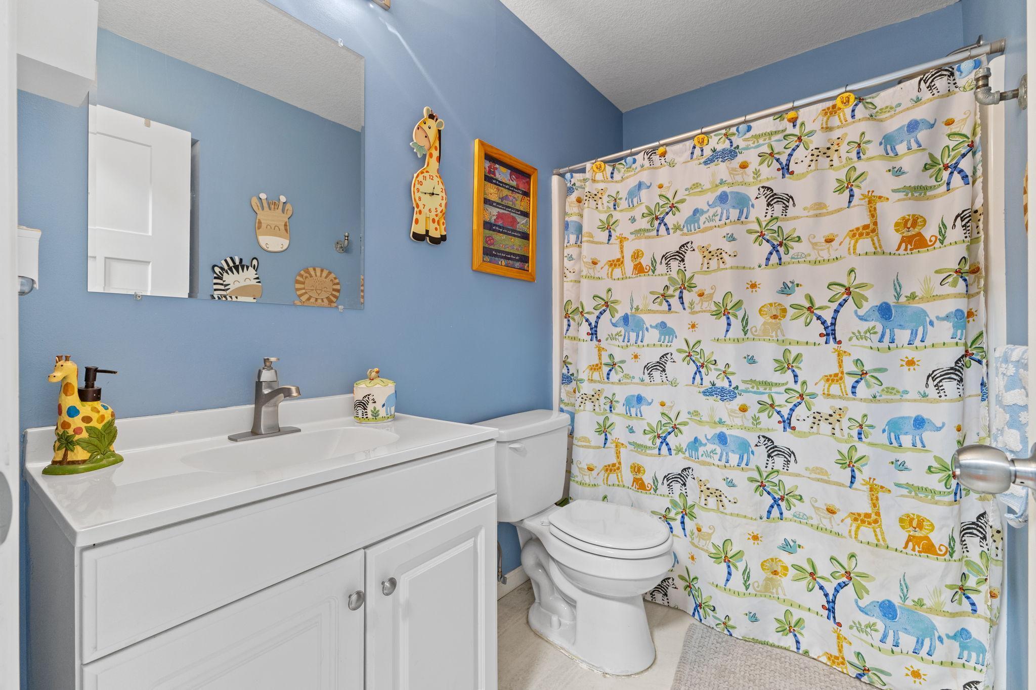 This full bathroom, located near the secondary bedrooms, makes morning routines a breeze.
