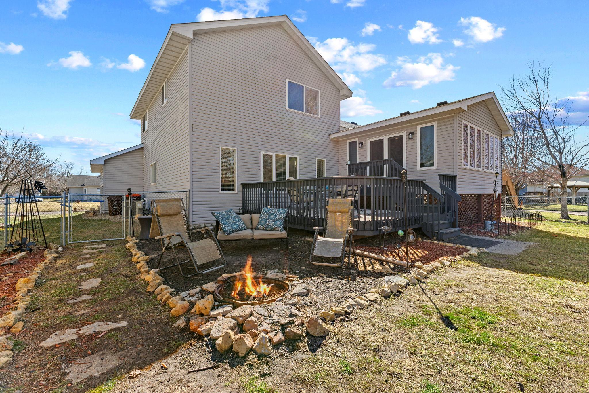Charming deck and built-in fire pit ready for summer nights!