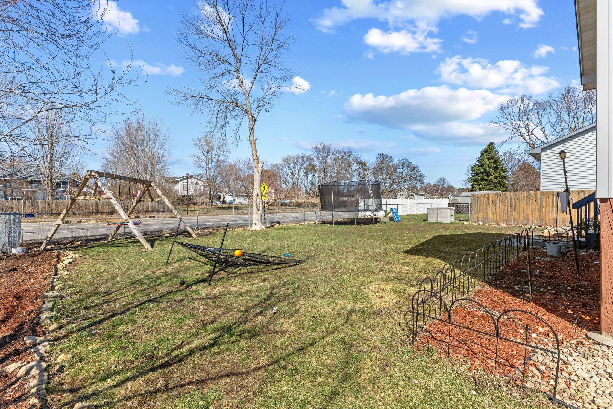 Ample green space perfect for yard games or allowing kids and pets to play!