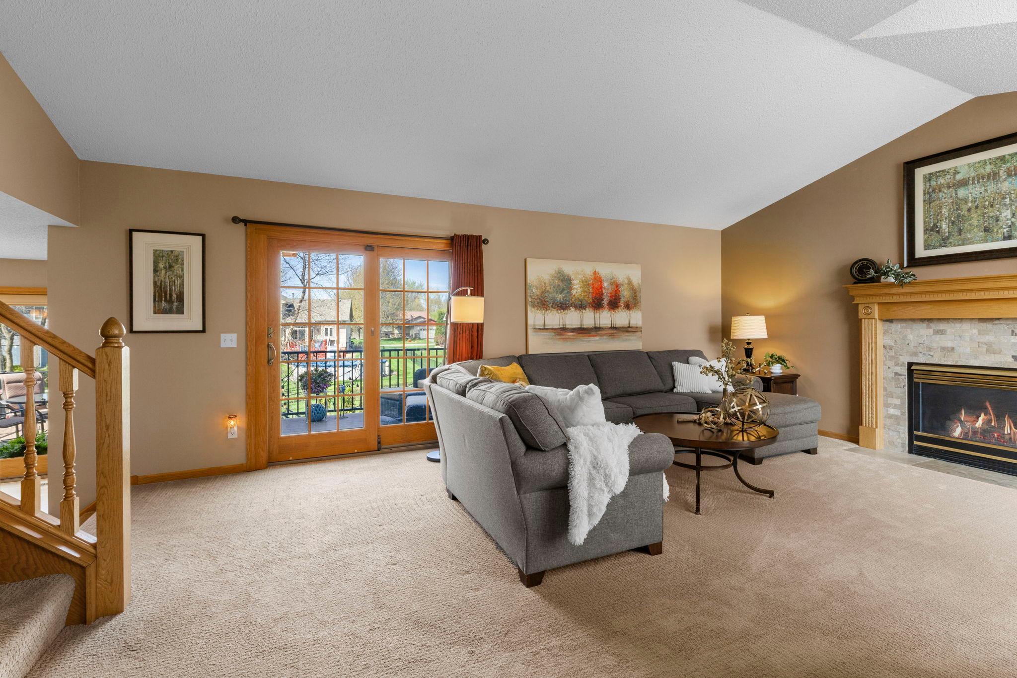 Living room walks to upper level deck, 20585 Georgia Ave Pl N