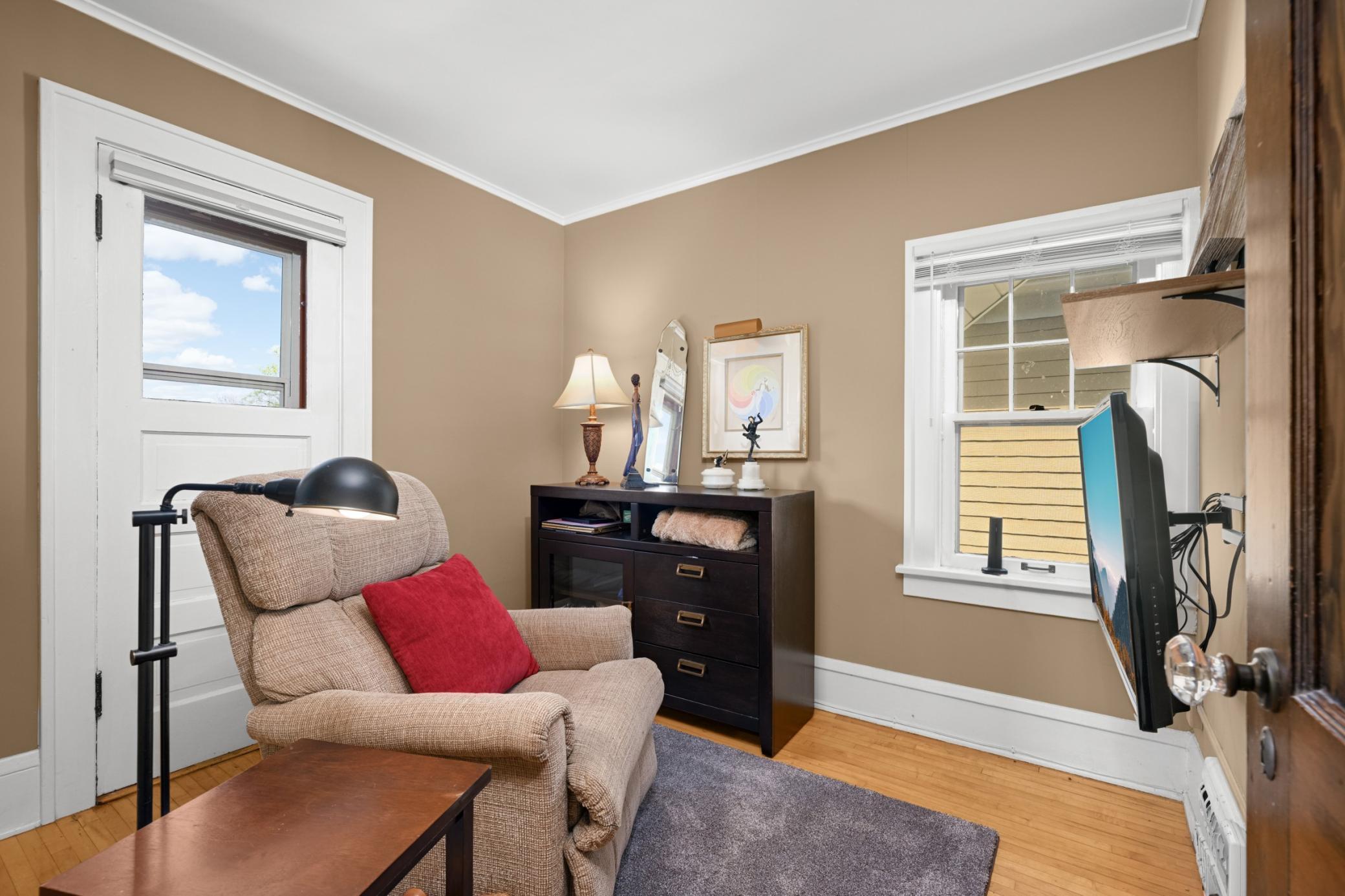 3rd bedroom, currently used as a sitting room, with balcony