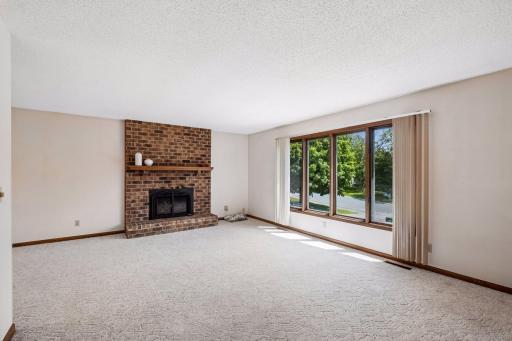 Another view of the beautiful firplace and large south facing windows in the living room.