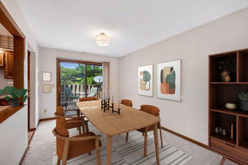 The living room, dining room and kitchen have great flow with one another. Here is a photo of the virtually staged dining room.