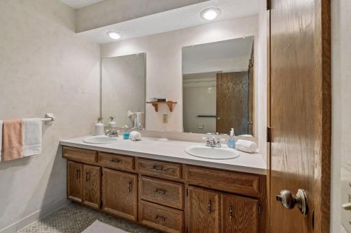 With two sinks, plenty of space, and a walkthrough to the primary, the upper level bathroom doesn't disappoint.