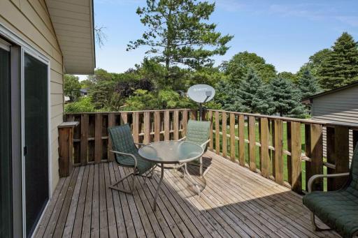 The upper level deck can be accessed from both the dining room and the primary bedroom.