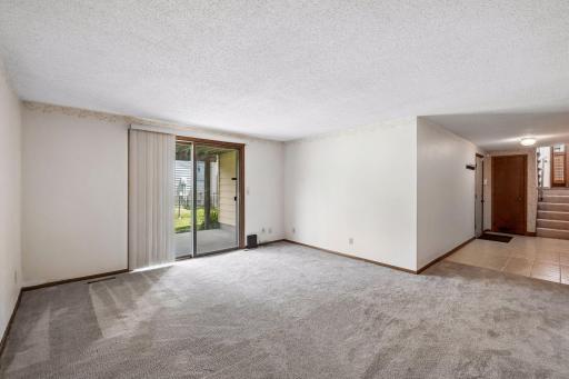 This view of the family room shows how it is connected to both the garage entryway and front entryway.