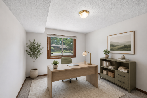 The lower level bedroom is virtually staged here as an office.