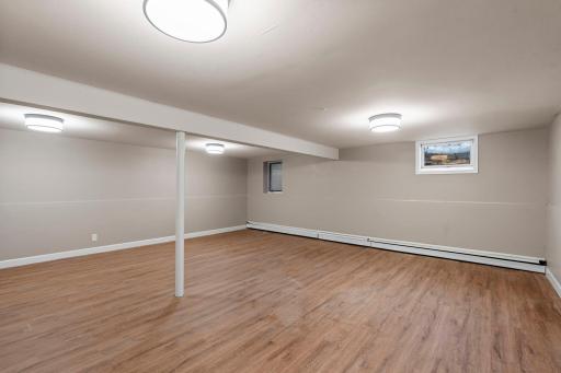 Finished lower level adds value with a large flex space or 4th bedroom. Updated vinyl flooring, egress window, new lighting and freshly painted.