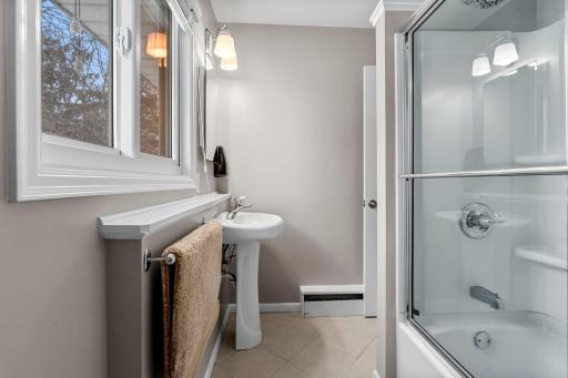 This bath was updated with new fixtures, new shower enclosure and tile flooring in about 2018.