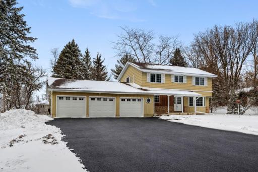 900+ Sq Ft Heated 3-Car Garage with Extra Parking Pad for Additional Vehicles or Toys