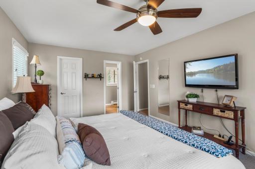 Primary Bedroom includes private enSuite Bath, Updated Doors, Trim, Lighting and Windows.