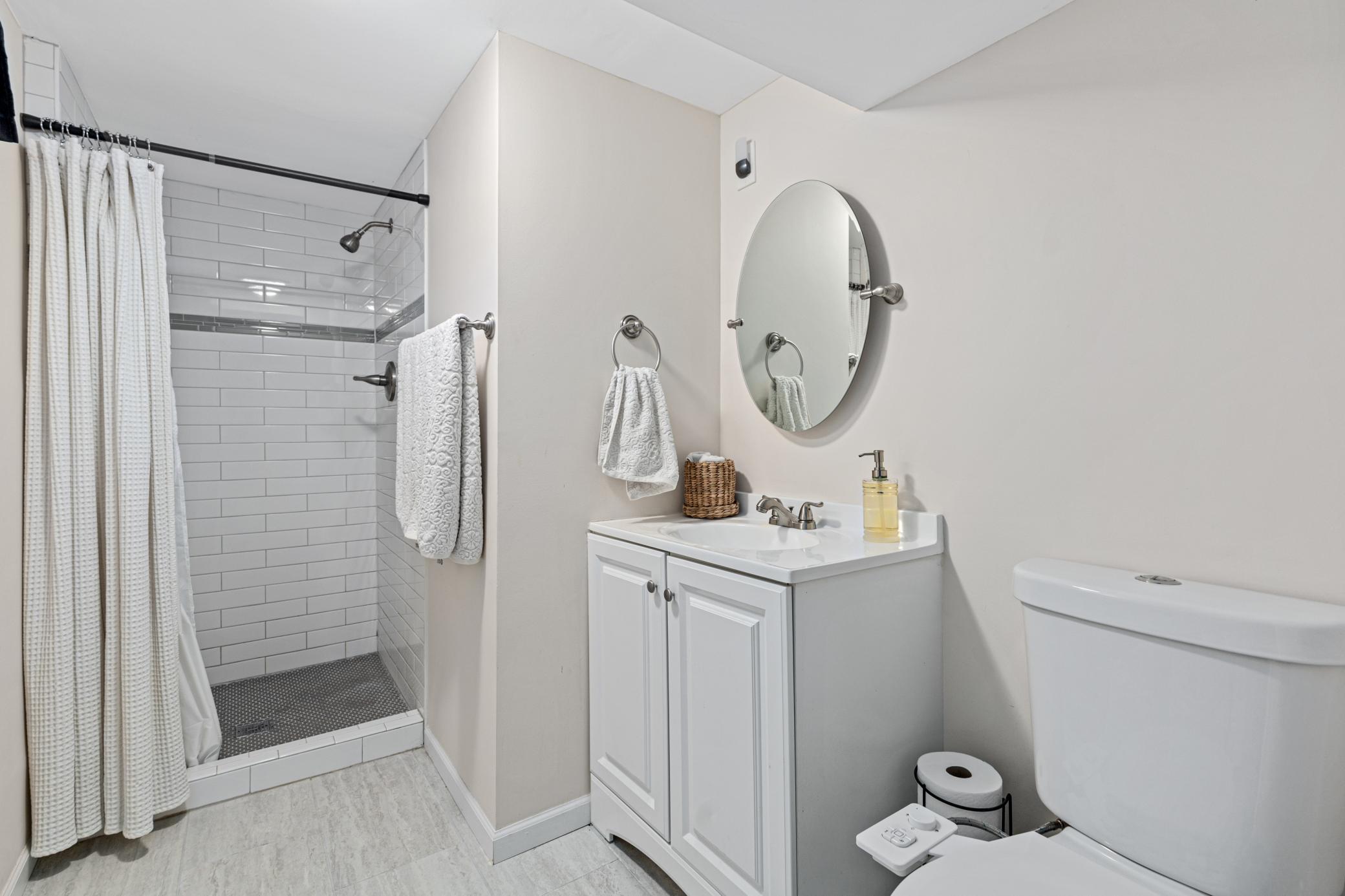 Basement 3/4 bathroom attached to the primary bedroom