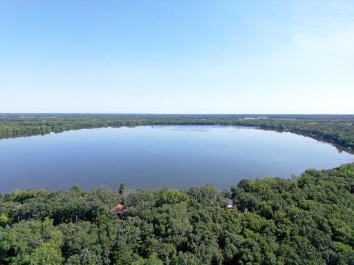 The yard is dotted with mature, towering trees providing natural shade and privacy, spend your days on the lake!