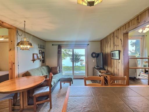 A breakfast bar with seating provides casual dining, while the adjacent dining nook is perfect for shared meals.
