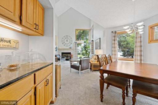 A formal Dining Area steps back from the Great Room. Airy and light, the feeling is cheerful and spacious. Virtually staged.