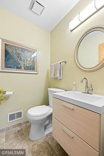 The updated main floor half bath is conveniently and privately located off of the family room.