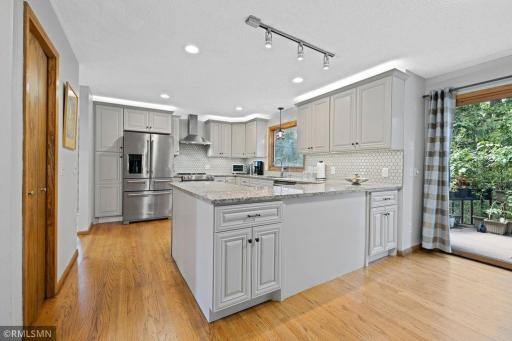 The kitchen's appliances are all premium brands and include a dbl-drawered refrig, a gas range with an exhaust hood, dishwasher, and microwave. The storage capacity is plentiful. The adjoining pantry bountiful, and Costco is minutes away.